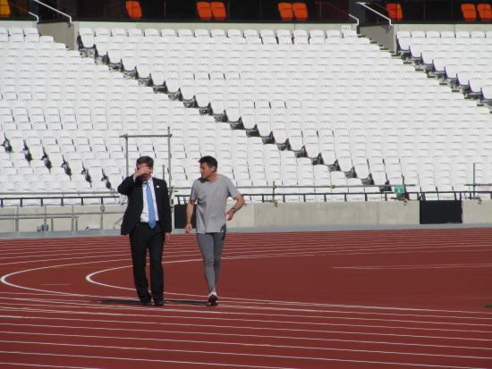 Hugh Robertson_with_Sebastian_Coe_on_Olympic_track_October_2011